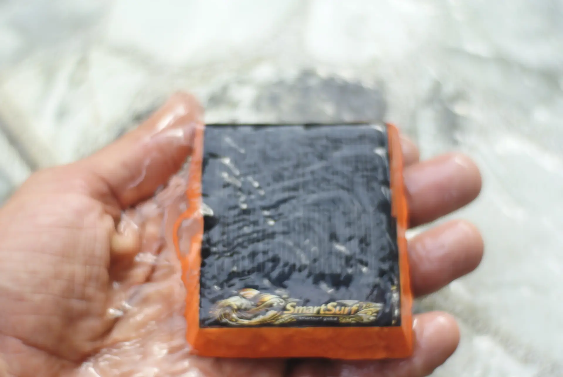 Tracker held under running water